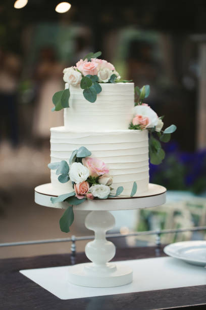 Beautiful wedding cake for the newlyweds at the wedding.  A birthday cake at a banquet. Beautiful wedding cake for the newlyweds at the wedding.  A birthday cake at a banquet. wedding cake stock pictures, royalty-free photos & images