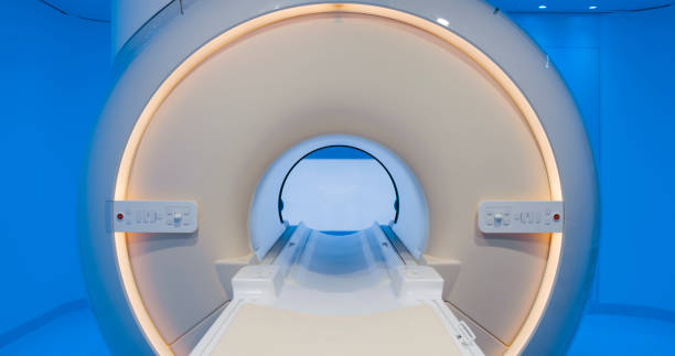 MRI scanner in hospital Close-up of MRI scanner in examination room at the hospital. mri scanner stock pictures, royalty-free photos & images