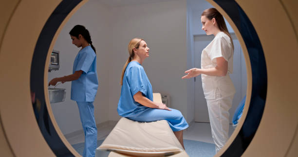 istock Woman talking with doctor before CAT scan 1357407602
