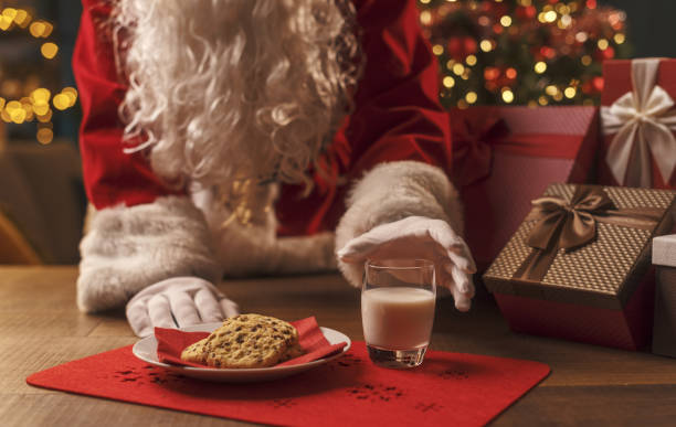 istock Santa Claus having a delicious snack 1357407636