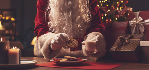istock Santa Claus having a delicious snack 1357407854