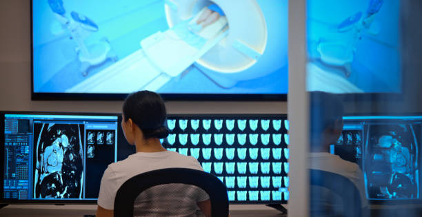 istock Female radiologist looking at the MRI scans on the computer 1357408051