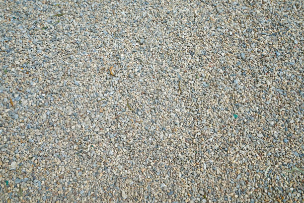 close up detail and surface of gravel pebbles stone and small granite rock - gravel imagens e fotografias de stock