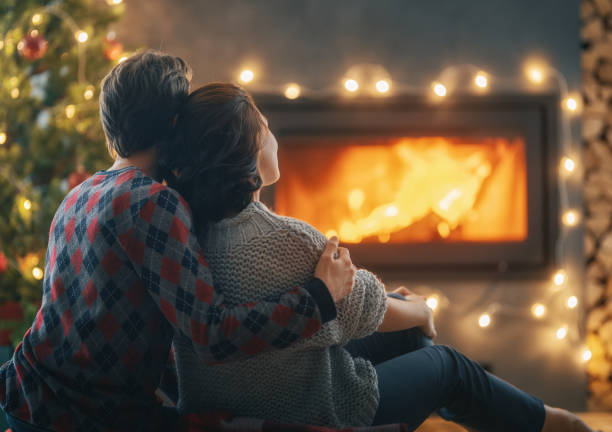istock couple relaxing near Christmas tree 1357412797