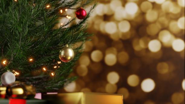 istock Christmas tree decorated with ornaments, light string, and gift boxes on blurred gold bokeh background. 3D illustration. 1357413904
