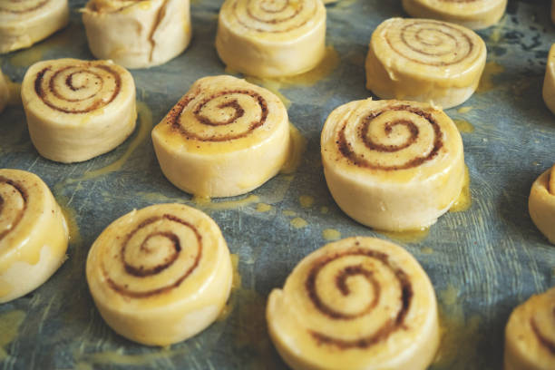 istock Blanks for baking cinnamon rolls on baking sheet with parchment paper. 1357414647