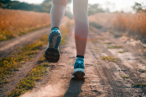 istock Young girl is running at sunset. 1357415541