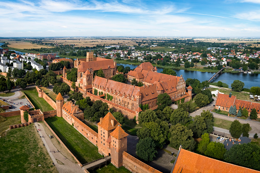 Malbork, Poland - August 15, 2021:Medieval Malbork Castle on the Nogat River, Poland.  Historical capital of the Teutonic Order - Crusaders