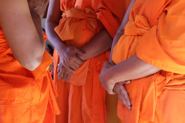istock Two monks holding their hands unobtrusively. 1357421652