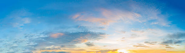 istock clouds and orange sky,Real panoramic sunrise sundown sky with gentle colorful clouds. Big size 1357422463