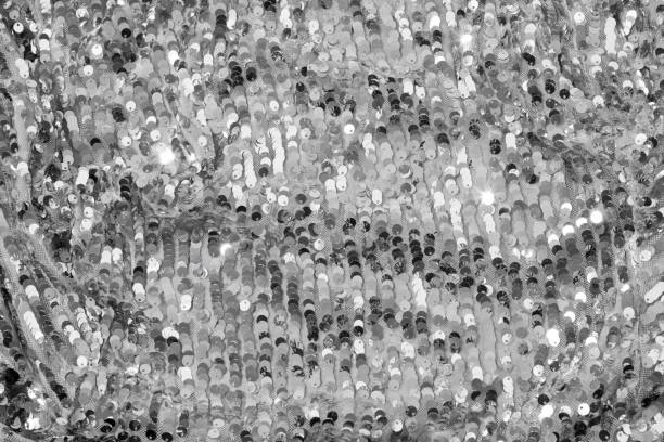 istock Shiny and glittering, silver fabric with sequins. Abstract background. Events, celebrations, Christmas, New Year. Trendy backdrop. 1357422952