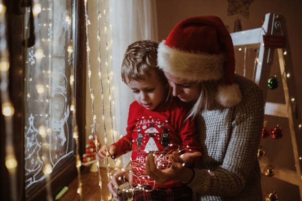istock Mother and son enjoy in Christmas night 1357424010