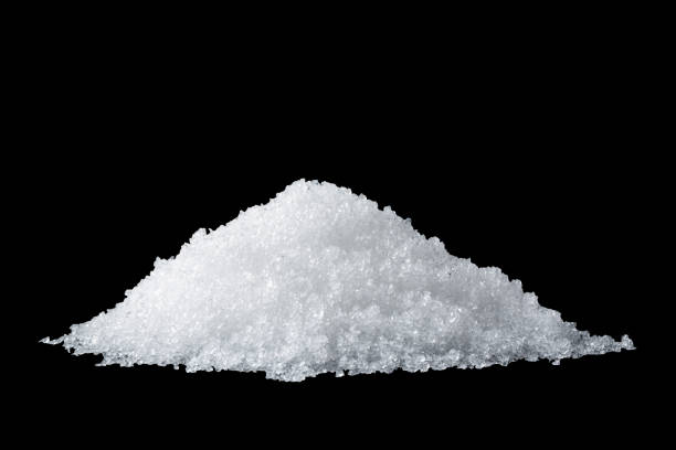 istock Heap of white snow isolated on black background 1357424092