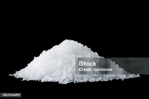 istock Heap of white snow isolated on black background 1357424092