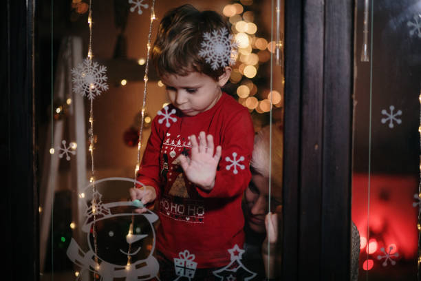istock Mother and son enjoy in Christmas night 1357424347