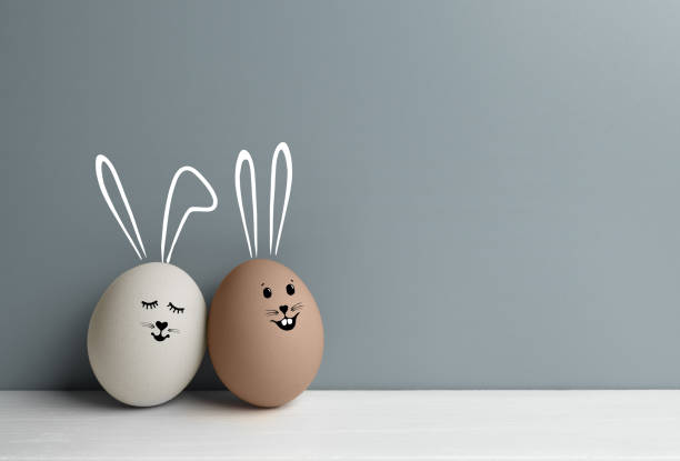 istock Pair of easter eggs with loving faces with bunny ears 1357425591