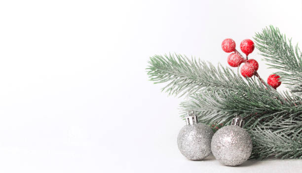 istock Christmas composition. Fir tree branches, silver decorations on white background. Christmas, winter, new year concept. Flat lay, top view, copy space 1357426447