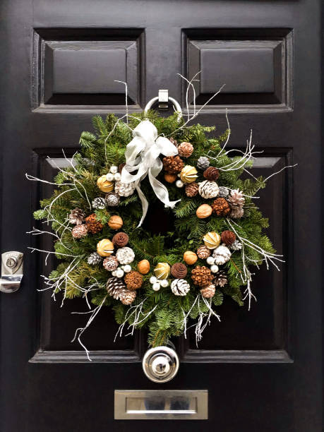 istock Christmas wreath on a black door 1357426616