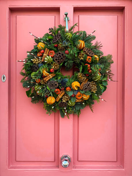 Christmas wreath on a pink door