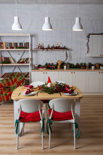 istock Beautiful table setting with Christmas decor in living room. 1357427186