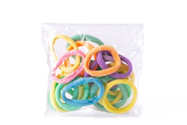 istock Multicolored  pastel elastic hair in transparent packaging  on white isolated background. 1357428029