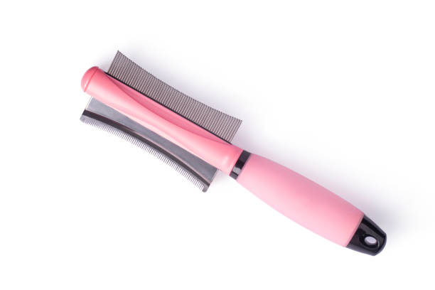 Dog grooming brush on white isolated background. Dog grooming brush on white isolated background. Two-sided Dog Comb Hair Removal Brush stock pictures, royalty-free photos & images