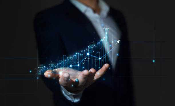 istock Business strategy development and growing growth plan. Businessman holding arrow up with graph of business analysis. Global business investment. Analyzing and data exchange 1357431446
