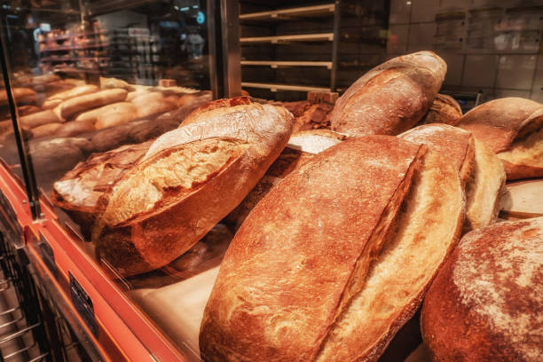 istock bread on a shelf in a bakery close-up on a dark background in a low key 1357433349