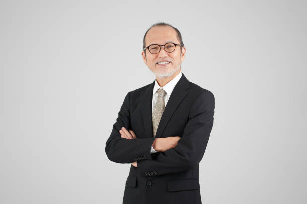 Asian elderly businessman with a fun look