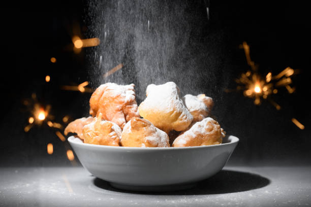 Oliebollen traditional Dutch New Year's eve pastry on a black background stock photo