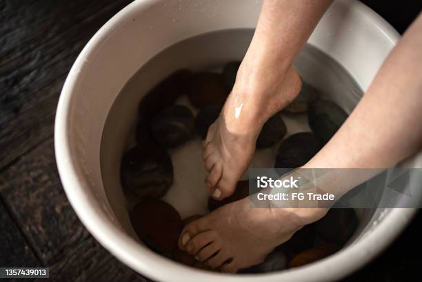 Feet Of An Adult Woman Doing Foot Therapy At A Spa Stock Photo - Download Image Now - Foot Bath, Water, Foot