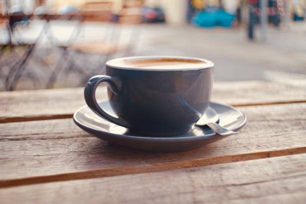 istock Cup of coffee on a rustic wooden table 1357439627