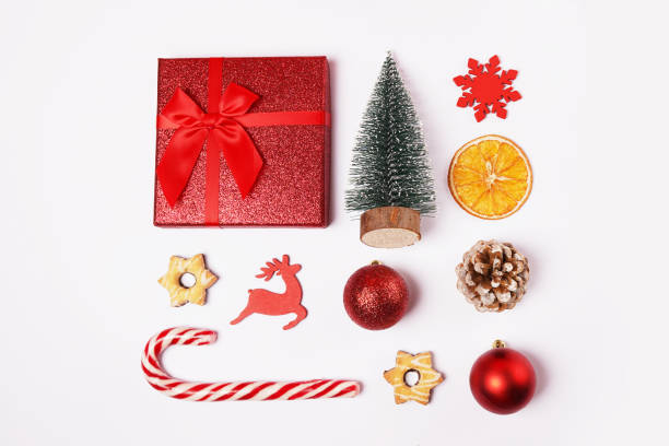 istock Christmas composition, decorations, fir tree, snowflake, candy cane and toys on white background. Flat lay, top view 1357440356