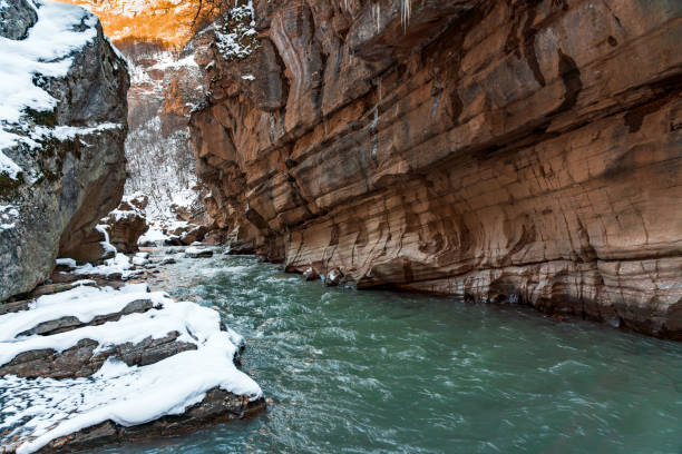 Fast mountain river in the gorge at winter season