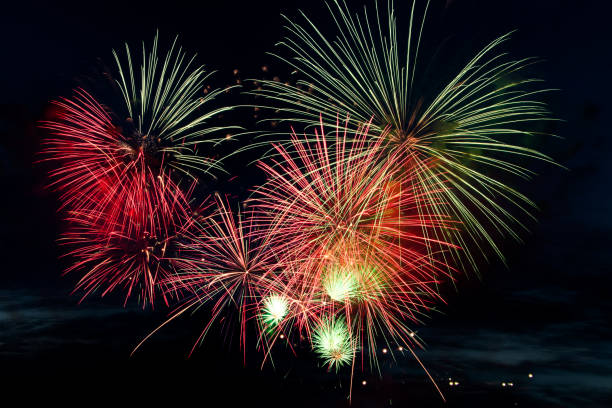 istock Colorful fireworks on black background. Celebration and holidays concept. Independence Day 4th of July, New Year, festival. Bright explosions of lights in sky. 1357441492