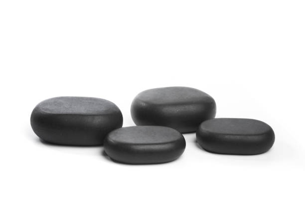 istock black spa stones isolated on white background - Image 1357444347