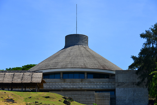 Honiara, Guadalcanal island, Solomon Islands: Solomon Islands Parliament Building - the building's conical roof invokes local vernacular roof styles - designed by Michael J. Batchelor of the Hawaiian architectural firm Wimberly Allison Tong & Goo. The National Parliament of Solomon Islands is a single chamber assembly with 50 members, elected for a four-year term in 50 single-seat constituencies.