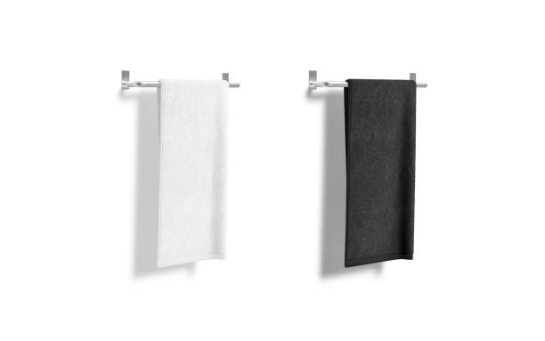 toalla blanca y negra en blanco en blanco sobre maqueta de riel calentado, aislada - towel hanging bathroom railing fotografías e imágenes de stock