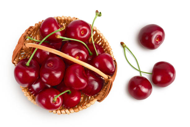 istock red sweet cherry in wicker basket isolated on white background with clipping path and full depth of field, Top view. Flat lay 1357446537