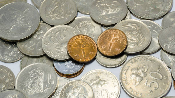 istock Close up of Malaysian Ringgit. Malaysian currency Ringgit on white background. Malaysian coin sen use for payment. 1357447393