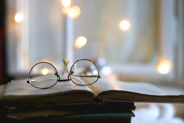 istock Book, Glasses and Candles 1357447512