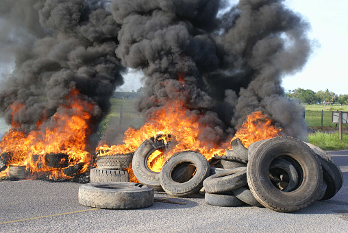 porto seguro, bahia, brazil - november 24, 2009: Tires burning during a protest on a highway in the state of Bahia.\