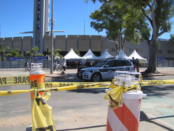 Centenario Stadium Final soccer Copa Conmebol Sudamericana 2021 Atletico Paranaense vs Bragantino. Police guard the entrance to the soccer field. The historic concrete stadium built in 1930 with modern architecture is the place where Brazilian football teams play the final in Montevideo Uruguay. Security is protected by the police. Clear sunny day in the stadium. Fans, Police, security. Montevideo, Uruguay. south american football confederation stock pictures, royalty-free photos & images