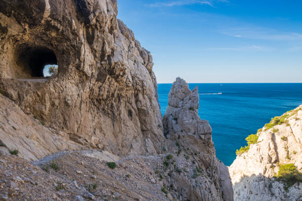 Limestone tunnel and coastal path between Niolon and Mejan