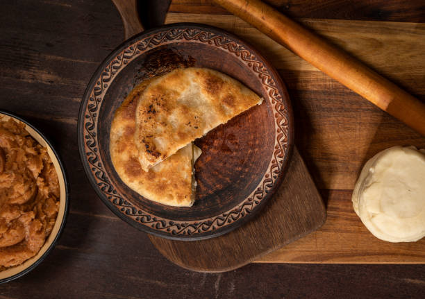 istock Prepared homemade pie with minced meat filling on the kitchen table 1357455873