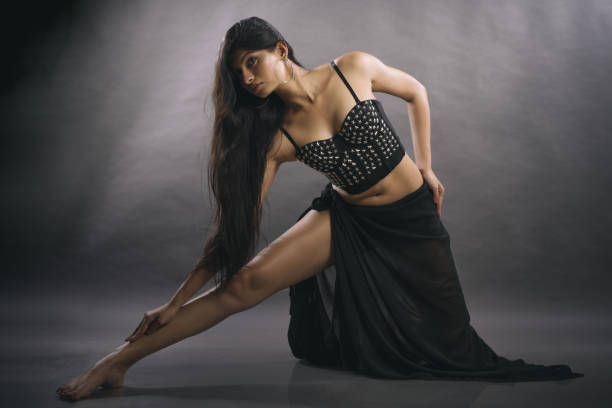 istock Active acrobatic dance poses by Indian young female model 1357456976