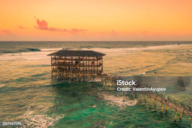 Sunset On Most Popular Surfing Area Cloud 9 At Siargao Philippines Aerial View Raised Wooden Walkway For Surfers To Cross The Reef Of Siargao Island To Cloud 9 Surf Break Mindanao Stock Photo - Download Image Now