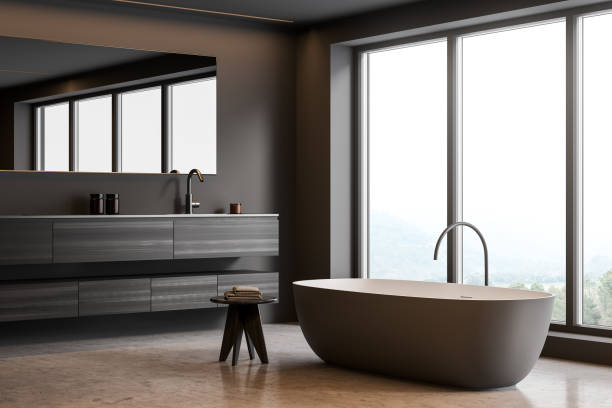 istock Close up view on dark bathroom interior with bathtub 1357457314