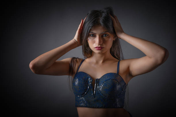Low key portrait of young female model with  moody expression