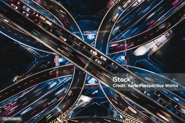 Drone Point View Of Overpass And City Traffic At Night Stock Photo - Download Image Now